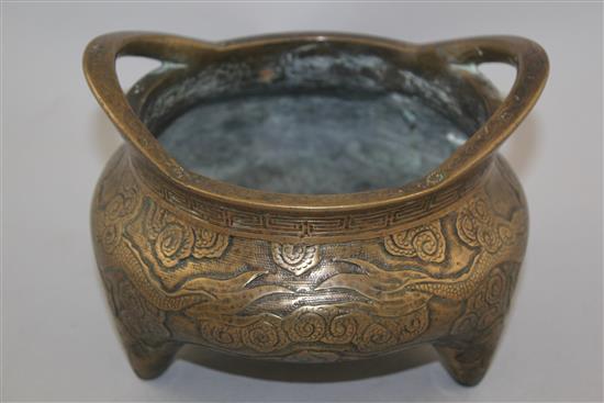 A Chinese bronze tripod censer, Xuande two character mark, 19th century, diam. 18cm, weight 2780g., old repair to base